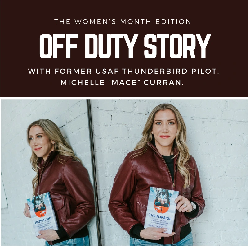 Former USAF Thunderbird pilot Michelle “Mace” Curran in a leather jacket, posing by a mirror while holding her book.