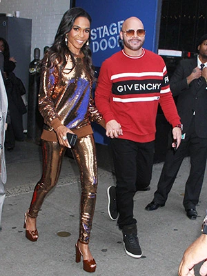 Michelle Williams and Chad Johnson walking together at an event
